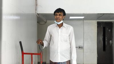 Sultan Amir Hussein, 50, originally from Bangladesh works as a watchman in Tourist Club Area. Khushnum Bhandari for The National