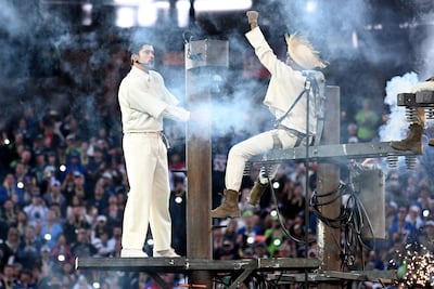 Bad Bunny climbs an electric pole during El Apagon (The Blackout), a song that criticises Puerto Rico’s chronic power cuts and failing infrastructure. AFP