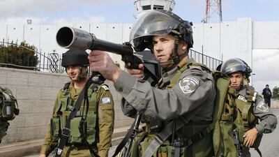 Israeli police aim at protesters near a checkpoint in Bethlehem. Mussa Qawasma / Reuters