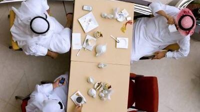 Emiratis in a cafe at the City Centre Mall in Dubai. A nutritionist suggests that wearing a tight-fitting pair of trousers can help to monitor progress when trying to lose weight.