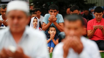 People pray in Almaty, Kazakhstan. Reuters