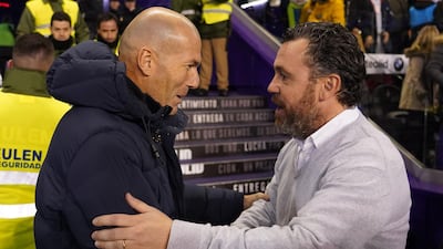 Real Valladolid's Spanish coach Sergio Garcia shakes hand with Real Madrid's French coach Zinedine Zidane before the match. AFP