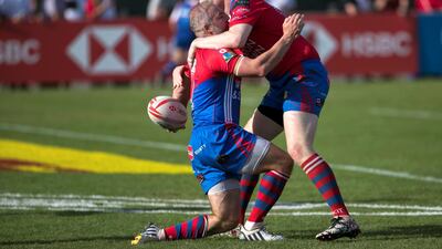 Ollie Phillips, left, after scoring his try for the 100 World Legends Project team in the International Vets final. Reem Mohammed / The National