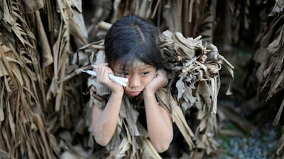 A child waits for the start of mass