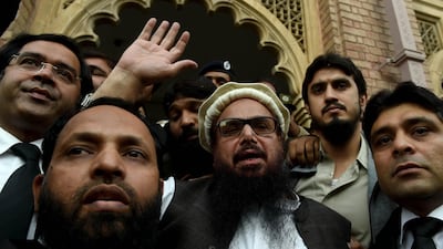 Pakistan has jailed Hafiz Saeed, centre, founder of Lashkar-e-Taiba but Pakistan’s performance in eliminating terrorist infrastructure remains in the grey zone. EPA