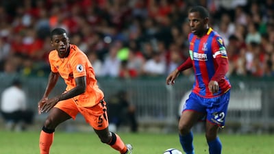 Georginio Wijnaldum of Liverpool chases Jason Puncheon of Crystal Palace during the Premier League Asia Trophy match between Liverpool and Crystal Palace at Hong Kong Stadium on July 19, 2017 in Hong Kong. Stanley Chou / Getty Images