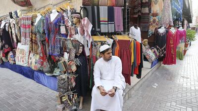 After iftar, the streets come alive again with businesses reopening and shoppers bargaining for deals. Pawan Singh / The National