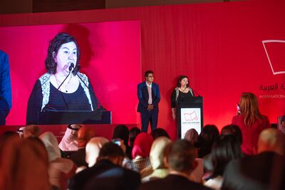 Rana Idriss, founder of Lebanese publisher Dar Al Adab, accepts the award on behalf of Basim Khandaqji, who has been in an Israeli jail for 21 years. Vidhyaa Chandramohan for The National