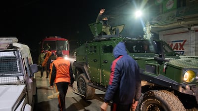 Members of the State Disaster Response Force near the site of an explosion inside a police station at Nowgam, where nine people were killed. AP