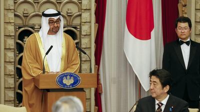 Abu Dhabi’s Crown Prince Sheikh Mohammed bin Zayed, left, delivers a speech during his state visit to Japan at the official residence of Japanese Prime Minister Shinzo Abe on February 26, 2014. Kimimasa Mayama/AFP
