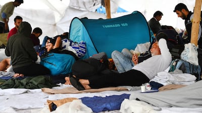 Refugees wait outside at the main reception centre for asylum seekers in Ter Apel, the Netherlands. Reuters