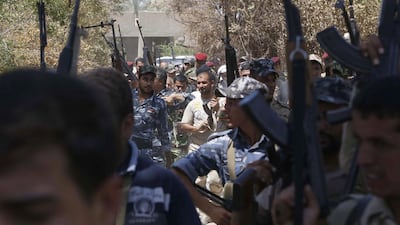 Iraqi soldiers from the Abbas Unit gather in Jurf Al Sakhr, 60 kilometres southwest of Baghdad on August 10, after they reportedly pushed back Islamist militants from the area. AFP