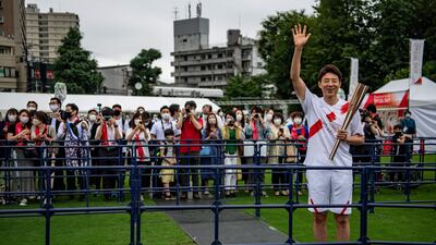 Former Japanese tennis player Shuzo Matsuoka at the Olympic torch relay.
