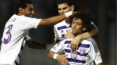 Al Ain officials announced they will begin transfer talks for their star player Omar Abdulrahman, centre, with interested European clubs next month. AFP