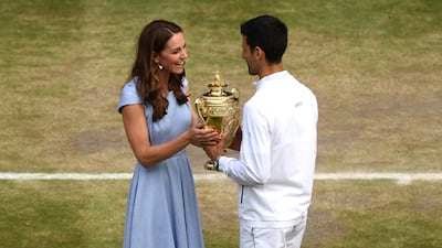 Catherine presents Novak Djokovic with the Wimbledon men's singles trophy in July 2019