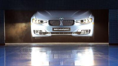 BMW boosted its total deliveries by 14 per cent to a record 281,460 luxury-car units last year. Above, the BMW ActiveHybrid 3 vehicle. Stan Honda / AFP
