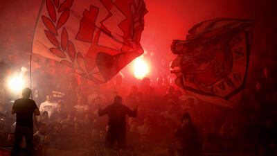 Red Star supporters wave flags and light flares during the Serbian Cup semi-final. AFP