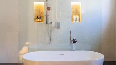 A large balcony has been fully enclosed and transformed into a spacious walk-through powder room and statement bathroom by Singature Living. Anna Nielsen / The National