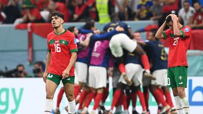 Morocco's Abde Ezzalzouli looks downcast after France celebrate their second goal in the 2-0 World Cup semi-final win at Al Bayt Stadium in Al Khor, Qatar, on December 14, 2022. EPA