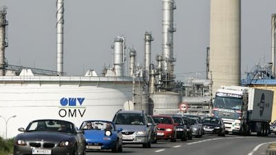 Cars pass by an OMV refiner in Vienna. AFP