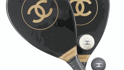 State of play: Chanel knocks it out of the park again with this wood and resin beach bat and ball set, priced at about Dh10,000. Courtesy Chanel