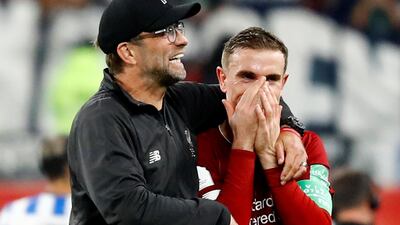 Liverpool manager Juergen Klopp celebrates with Jordan Henderson after the match. Reuters