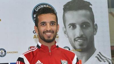 Mabkhout stands proudly with his Guinness World Records certificate.