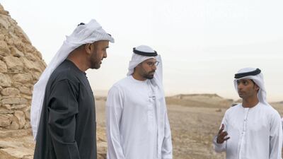 Sheikh Mohamed bin Zayed, Crown Prince of Abu Dhabi and Deputy Supreme Commander of the UAE Armed Forces (L) inspects Jebel Hafeet tombs. Seen with Mohamed Khalifa Al Mubarak, Chairman of the Department of Culture and Tourism and Abu Dhabi Executive Council Member (C). Rashed Al Mansoori / Ministry of Presidential Affairs