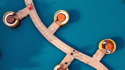 People get ready to eat at a floating cafe in Nakhon Pathom, west of the Thai capital Bangkok. AFP