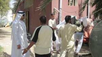 Hamam Alawi, left, gets tough with residents of Al Ain who hang their washing outside.