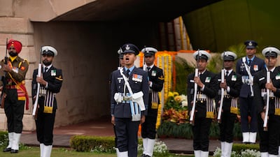 Indian soldiers pay their respects to Gandhi in New Delhi. AP