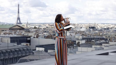 Iga Swiatek of Poland kisses her trophy. EPA