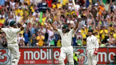 Andrew Symonds celebrates reaching his century with teammate Matthew Hayden during a Test between Australia and England. PA