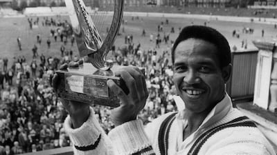 Holding the Guiness Trophy as captain of the Rest of the World Cricket team, after their victory against England at the Final Test match held at the Oval, in August 1970. Getty Images