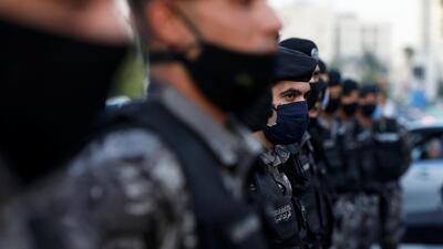 Police officers stand guard during a protest against cartoon publications of Prophet Mohammad in France and French President Emmanuel Macron's comments, near the French Embassy in Amman, Jordan.. REUTERS