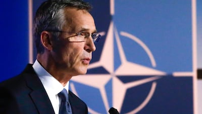 Secretary General Jens Stoltenberg with the Nato symbol in the background. AFP
