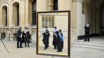 Graduates queue to have their photograph taken after a graduation ceremony at Oxford University in England. Paul Hackett / Reuters