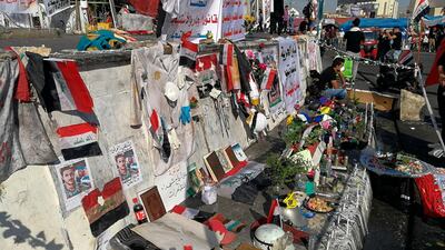Posters of protesters who have been killed in demonstrations, their belongings, and protesters' slogans are displayed in Tahrir Square during ongoing anti-government protests in Baghdad, Iraq. AP Photo