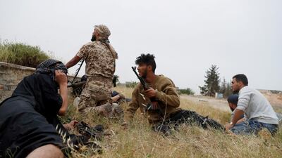 GNA fighters take cover. Reuters