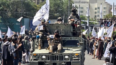 Members of the Taliban attend a rally to mark their return to power five years ago. Reuters