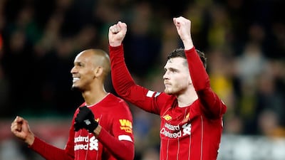 Liverpool's Andrew Robertson, right, and Fabinho celebrate at the end of the match against Norwich. AP
