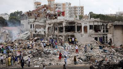 Somali government forces and civilians gather at the scene. Feisal Omar / Reuters