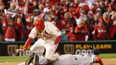 Allen Craig, top, trips of Will Middlebrooks, bottom, in Game 3 of the World Series on Saturday. Chris Lee / AP / St Louis Post-Dispatch