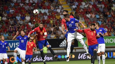 Spain striker Diego Costa heads the ball to score the opening goal. Alvaro Barrientos / AP Photo