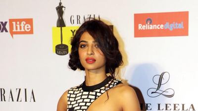 Radhika Apte in a Urvashi Joneja jumpsuit with a brick-patterned cape at the Grazia Young Fashion Awards 2015 ceremony in Mumbai on April 15, 2015. AFP
