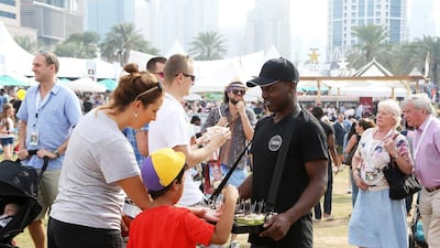People trying different types of food at the taste of Dubai 2016 held at Dubai Media City Amphitheater in Dubai. (Pawan Singh / The National