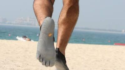 Paul Hymers runs in his Vibram Fivefingers at Jumeirah beach in Dubai.