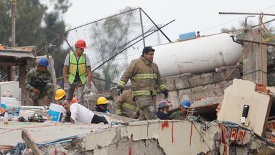 Rescue workers search through the rubble for students at Enrique Rebsamen school after an earthquake in Mexico City. Edgard Garrido / Reuters