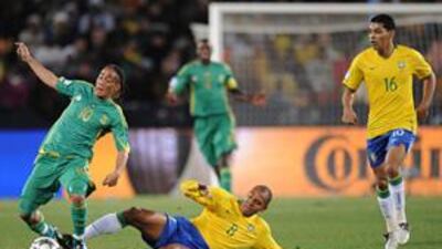 South Africa's Steven Pienaar, left, is fouled by Brazil's Gilberto Silva, No 8, during the Confederations Cup semi-final on June 25.