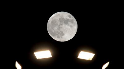The harvest moon above street lights in Beirut, Lebanon. EPA